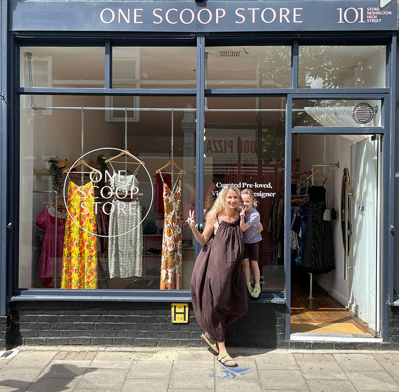 Holly standing outside her second-hand fashion store