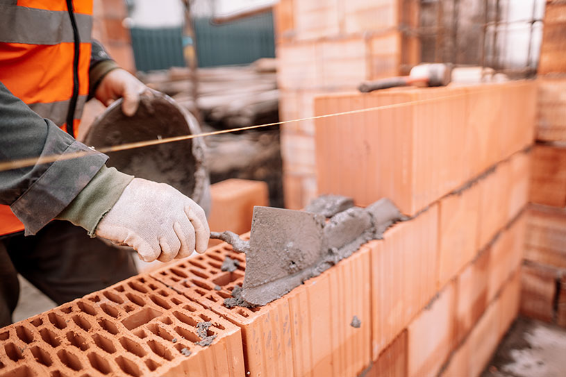 A bricklayer laying bricks