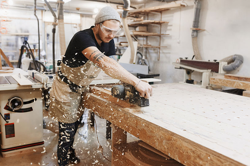 A carpenter works in his shop