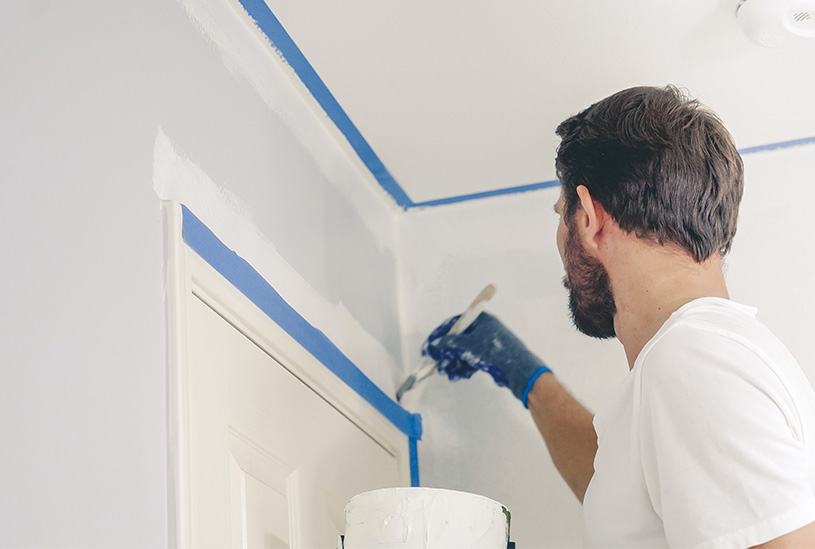 Landlord painting a room in their rental property