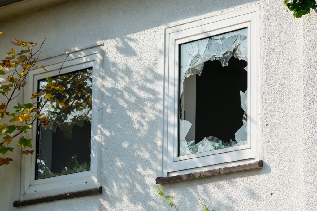 A broken window on a rental property