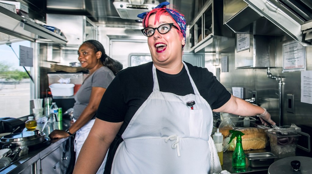 Two cooks in a mobile catering van