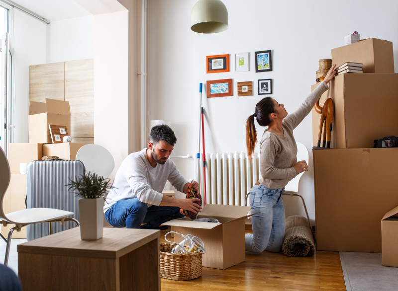 A couple unpacking boxes in a new property