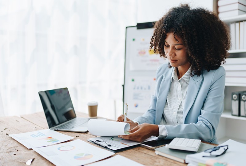 Business owner doing due diligence checks at a desk