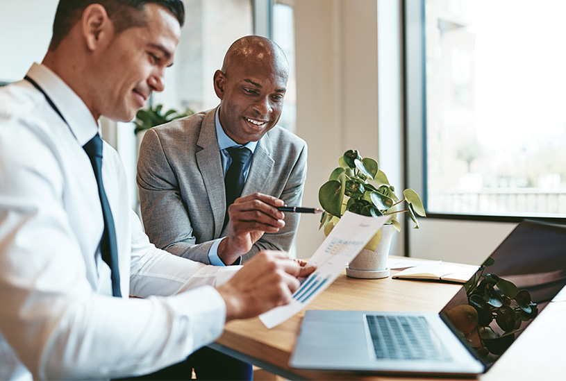 Business partners looking at accounts