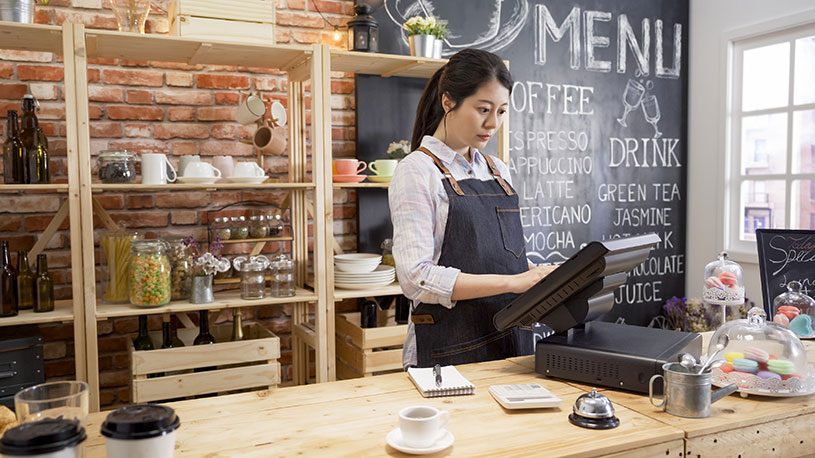 Business owner completing a sale on her POS system