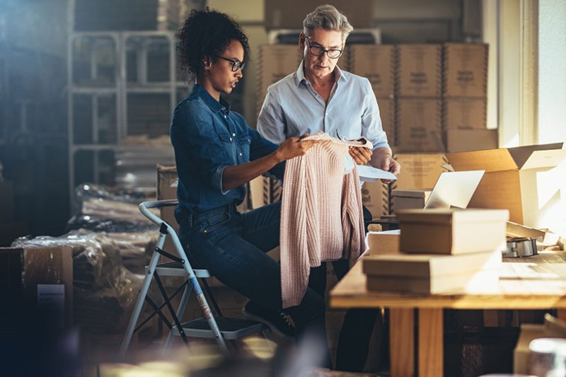 Two business owners checking product before delivering to customer