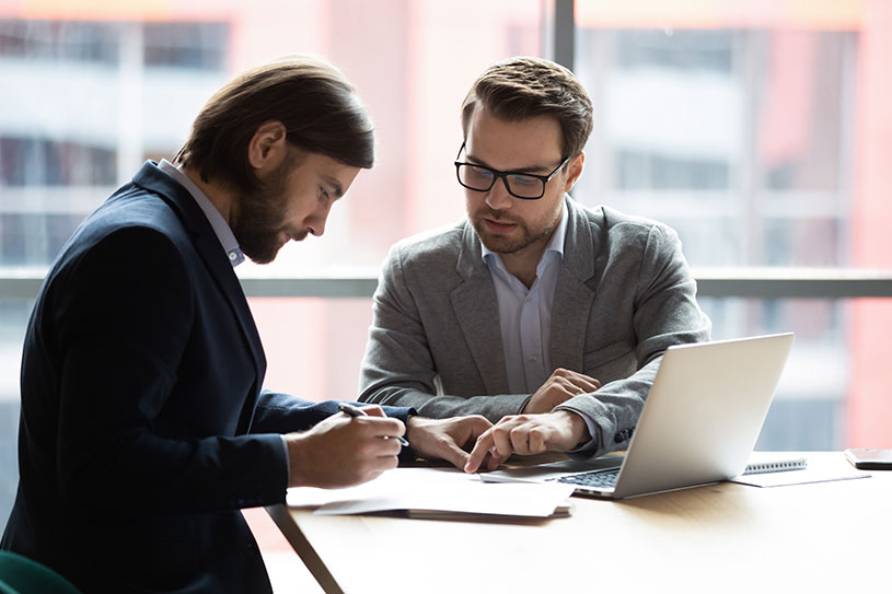 A business consultant helps a business owner