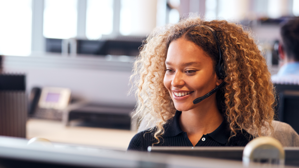 Woman talking on a headset in the office