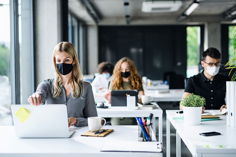 Office workers wearing masks