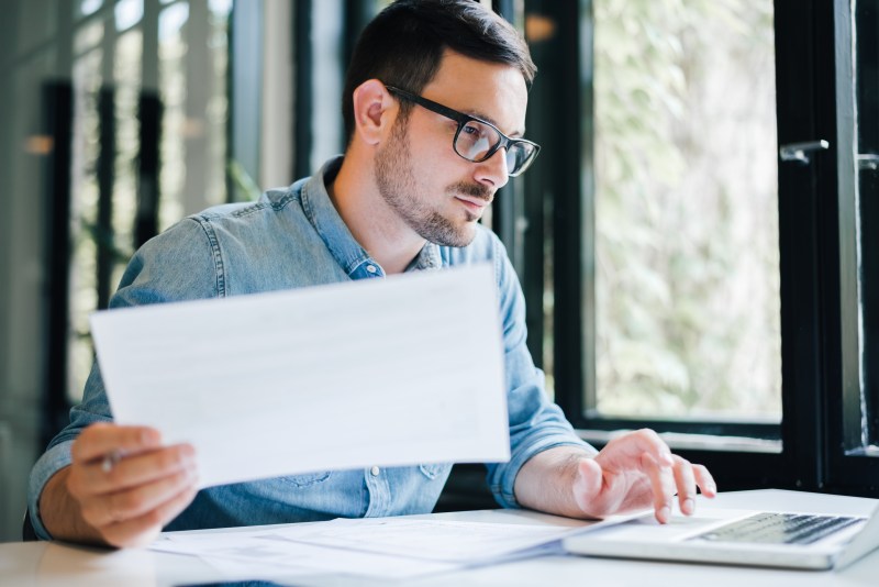 Self-employed person checking their tax records