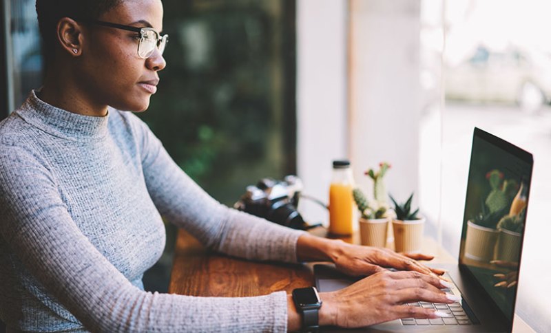 Business woman working on website on laptop