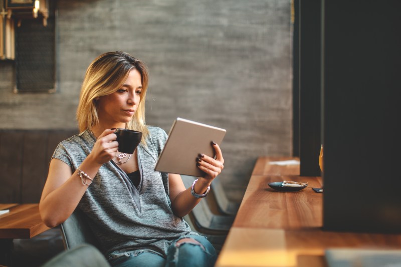 Businesswoman looking at tax on tablet