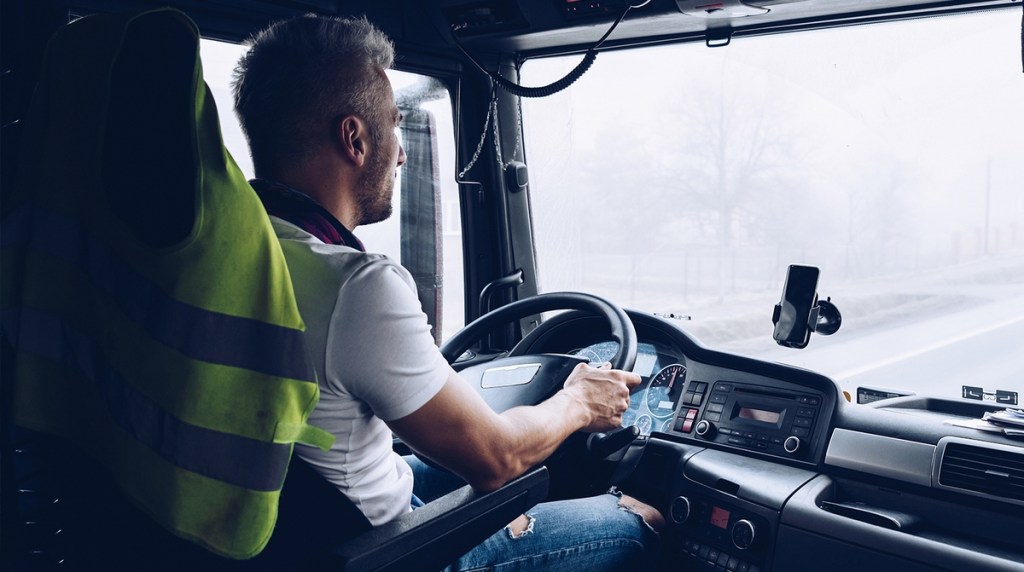 Driver sat in a HGV on the road