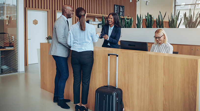 Two guests checking in to a hotel