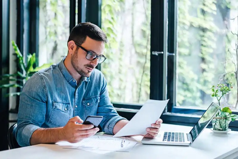 Businessman working at laptop