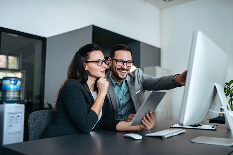 Two business people working together in an office