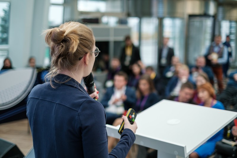 Woman presenting to an audience