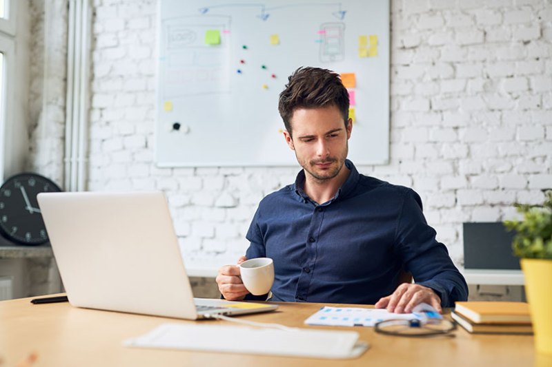 Office worker looking at important papers