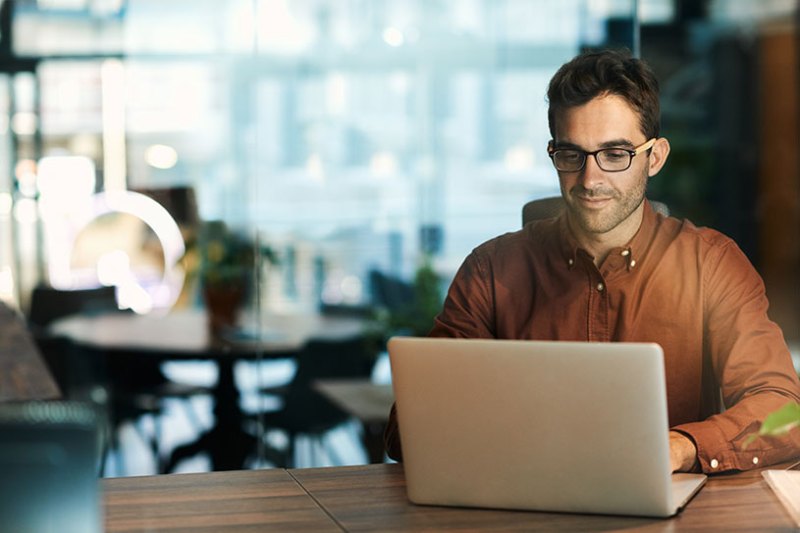 Man with laptop in office