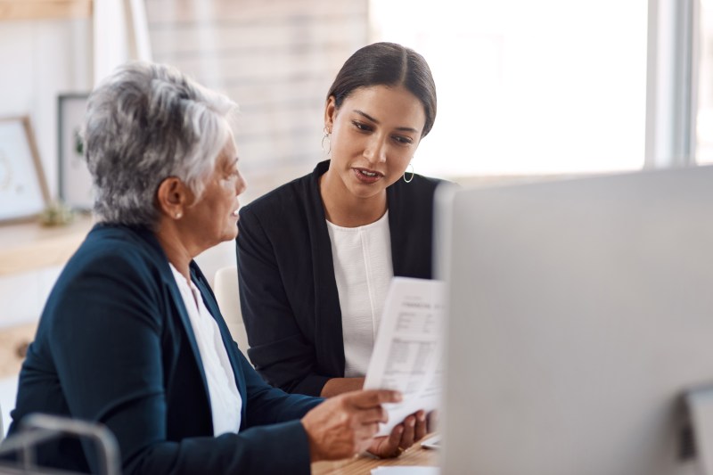 Business owner talking to their employee