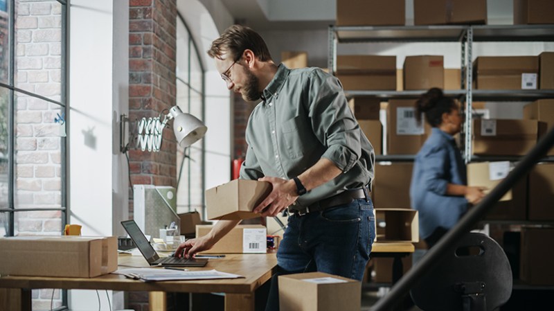 Small business sorting parcels in a warehouse