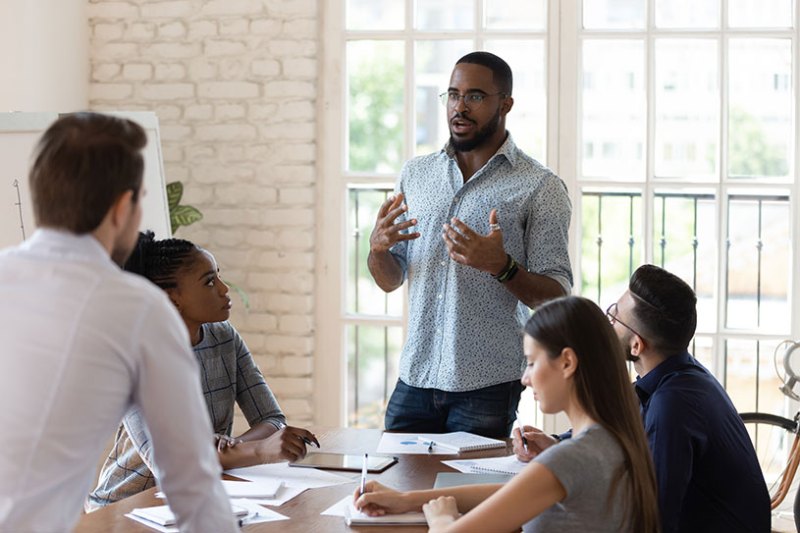 Manager presenting to team during meeting