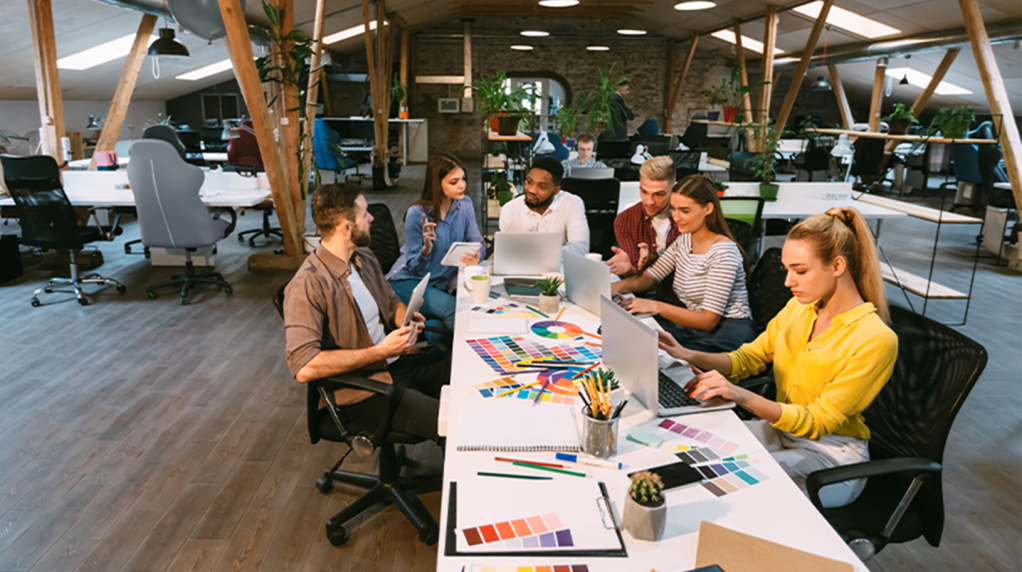 Advertising agency gathering around a table