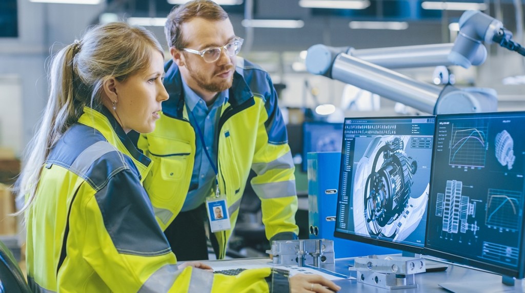 Two mechanical engineers looking at a computer