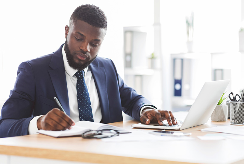 Businessman calculating profit and loss