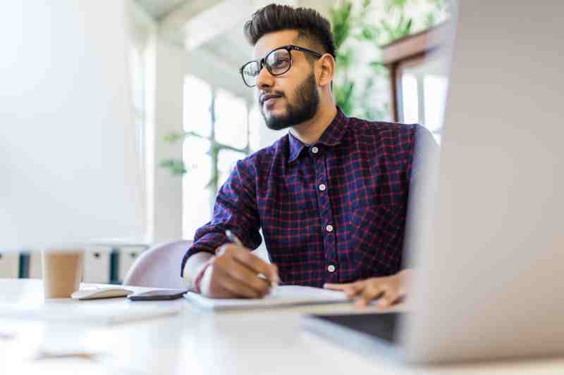 Businessman with papers and laptop