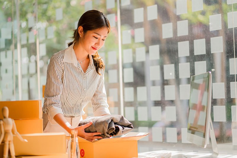 Small business owner preparing parcels to sell on Amazon