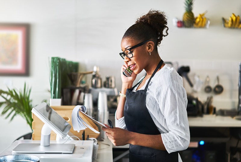 Coffee shop manager on the phone