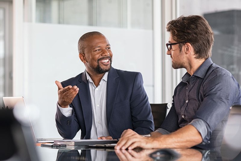 A business mentor and mentee having a meeting