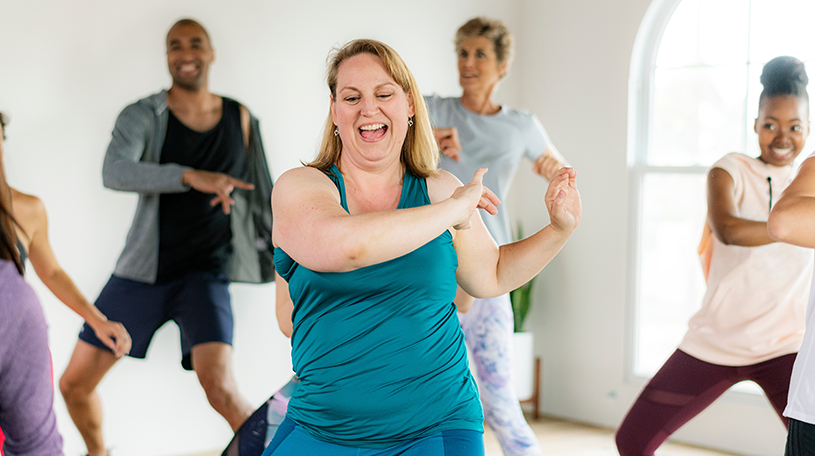 Group of people dancing in a fitness studio