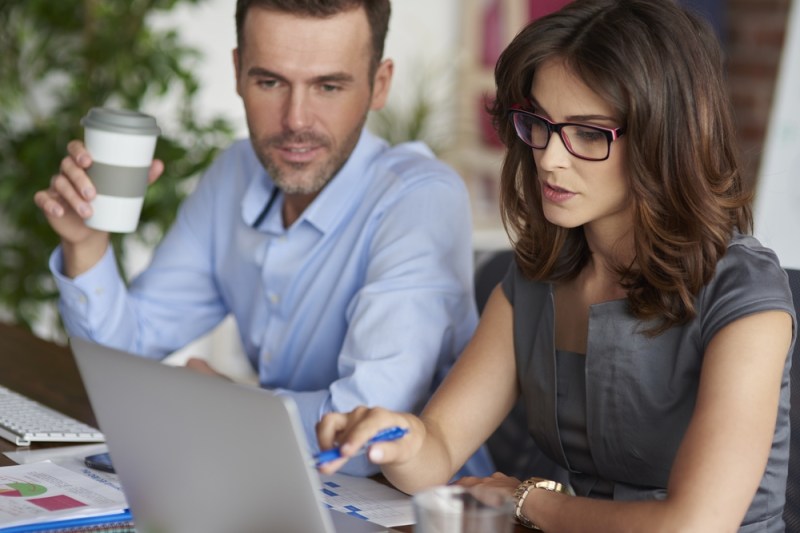 Two professional contractors working in an office