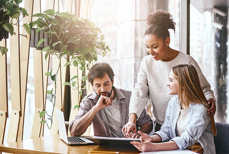 Business owner in meeting with customers