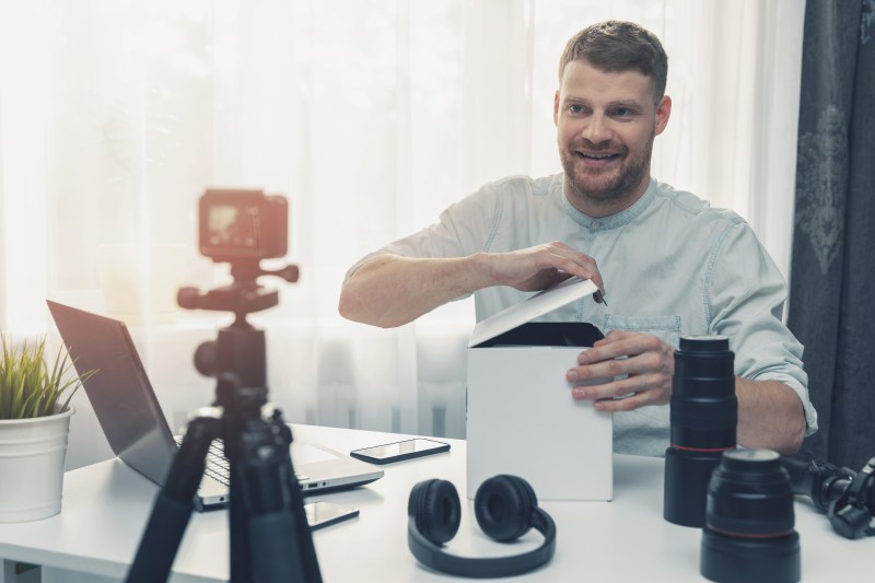 Influencer filming an unboxing of a product