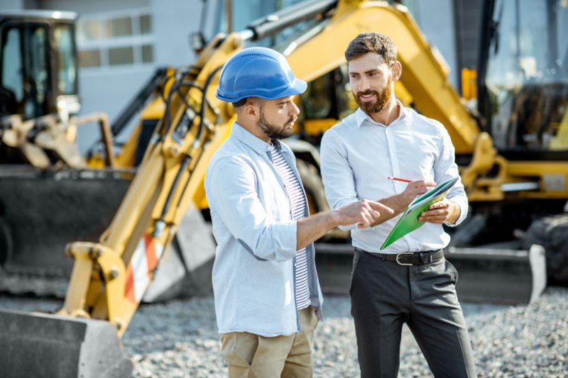 Tradesman agreeing to buy new vehicle.