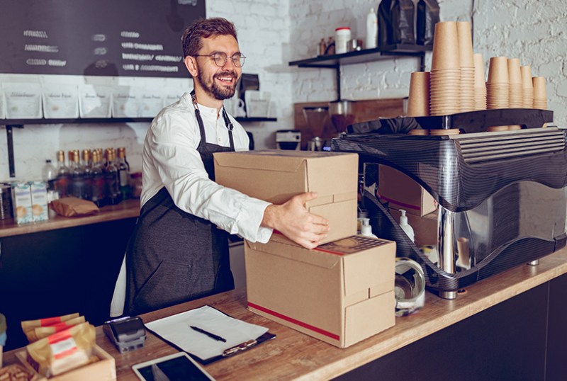 Cafe worker accepting a delivery