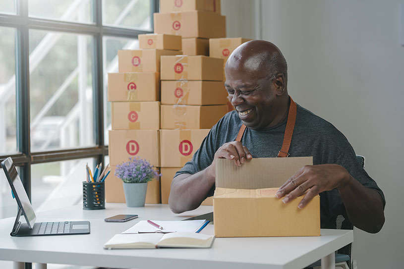 Man packing a box for his eBay shop