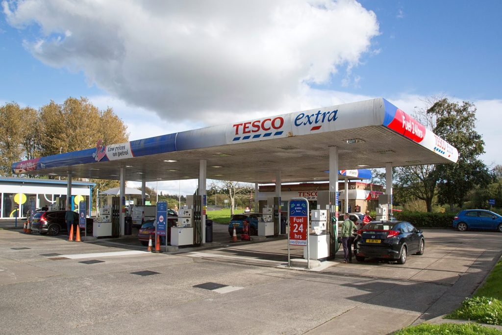 Customers refuelling at Tesco petrol station