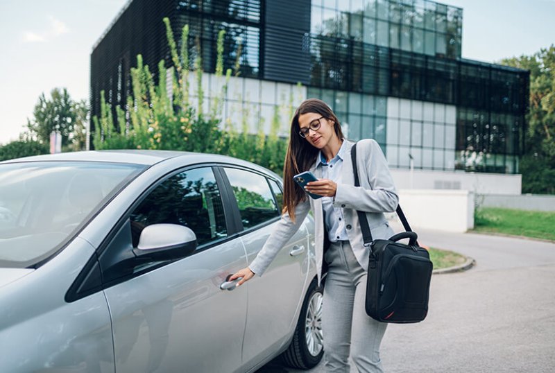 Businesswoman using company car